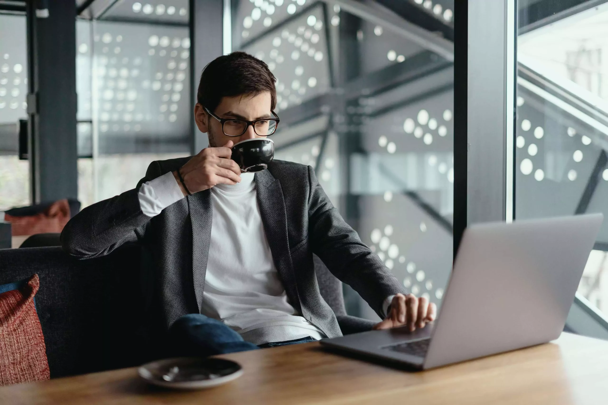 ATTACHMENT DETAILS successful-business-man-working-laptop-while-drinking-coffee